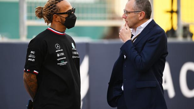 BAHRAIN, BAHRAIN - MARCH 20: Lewis Hamilton of Great Britain and Mercedes talks with Stefano Domenicali, CEO of the Formula One Group prior to the F1 Grand Prix of Bahrain at Bahrain International Circuit on March 20, 2022 in Bahrain, Bahrain. (Photo by Clive Mason/Getty Images)