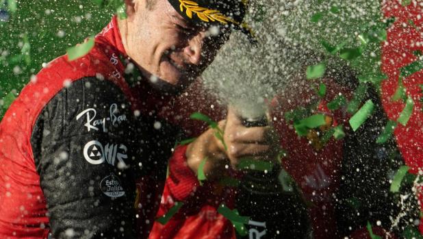 epa09881714 Monaco's Formula One driver Charles Leclerc of Scuderia Ferrari celebrates on the podium after winning the Formula One Grand Prix of Australia at Albert Park Circuit in Melbourne, Australia, 10 April 2022.  EPA/SIMON BAKER