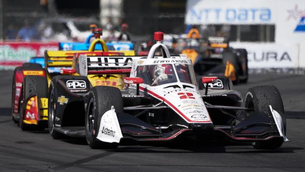 Team Penske driver Josef Newgarden (2) of United States leads the pack during an IndyCar auto race at the Grand Prix of Long Beach on Sunday, April 10, 2022, in Long Beach, Calif. (AP Photo/Ashley Landis)