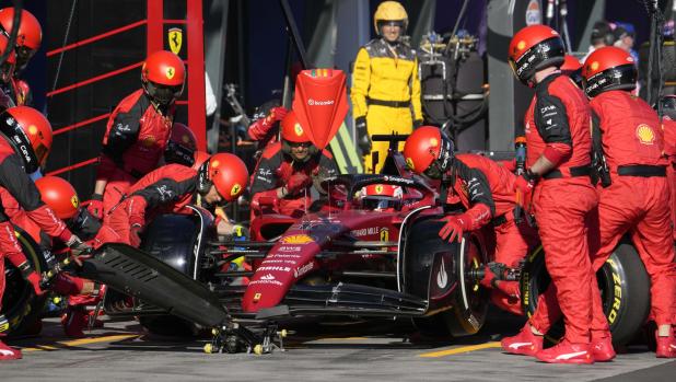 Mechanics for Ferrari driver Charles Leclerc of Monaco change his tires during a pit stop at the Australian Formula One Grand Prix in Melbourne, Australia, Sunday, April 10, 2022. (Simon Baker, Pool via AP)