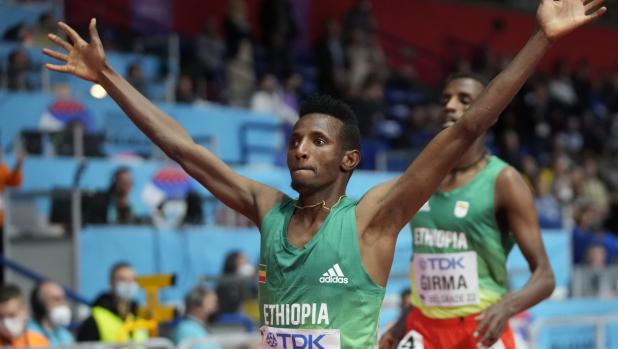 Selemon Barega, of Ethiopia, celebrates, after winning the Men's 3000 meters at the World Athletics Indoor Championships in Belgrade, Serbia, Sunday, March 20, 2022. (AP Photo/Darko Vojinovic)
