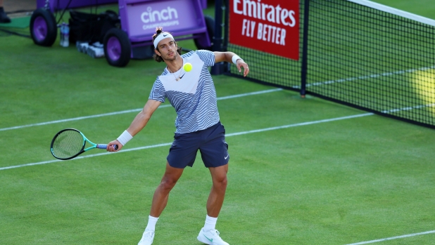 LONDON, ENGLAND - JUNE 19: Lorenzo Musetti of Italy celebrates winning match point against Jan Choinski of Great Britain during the Men's First Round match on Day One of the cinch Championships at The Queen's Club on June 19, 2023 in London, England. (Photo by Luke Walker/Getty Images for LTA)