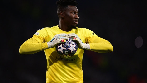 Inter Milan's Cameroonian goalkeeper #24 Andre Onana holds onto the ball during the UEFA Champions League final football match between Inter Milan and Manchester City at the Ataturk Olympic Stadium in Istanbul, on June 10, 2023. (Photo by Marco BERTORELLO / AFP)
