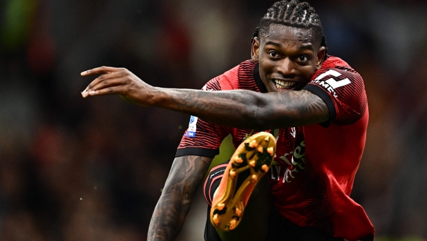 TOPSHOT - AC Milan's Portuguese forward Rafael Leao shoots to score his second goal during the Italian Serie A football match between AC Milan and Hellas Verona on June 4, 2023 at the San Siro stadium in Milan. (Photo by GABRIEL BOUYS / AFP)