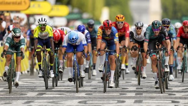 Belgium's Jordi Meeus, front row right, crosses the finish line ahead of Belgium's Jasper Philipsen, wearing the best sprinter's green jersey, far left, Netherlands' Dylan Groenewegen, third from left, Denmark's Mads Pedersen, center, and Eritrea's Biniam Girmay, second left, to win the twenty-first stage of the Tour de France cycling race over 115 kilometers (71.5 miles) with start in Saint-Quentin-en-Yvelines and finish on the Champs-Elysees avenue in Paris, France, Sunday, July 23, 2023. (AP Photo/Thibault Camus)