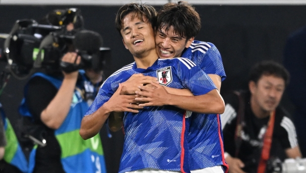 epa10851480 Japan's Takefusa Kubo (L) and Japan's Ao Tanaka (R) celebrate after scoring the 1-4 goal during the friendly soccer match between Germany and Japan in Wolfsburg, Germany, 09 September 2023.  EPA/FILIP SINGER