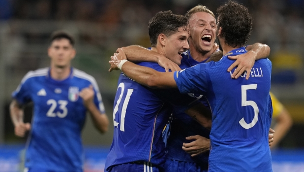 Italy's Davide Frattesi, second from right, celebrates with his teammates after scoring against Ukraine during the Euro 2024 group C qualifying soccer match between Italy and Ukraine at San Siro Stadium, in Milan, Italy, Tuesday, Sept.12, 2023. (AP Photo/Antonio Calanni)