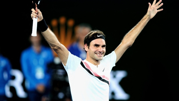 (181227) -- BEIJING, Dec. 27, 2018 (Xinhua) -- Photo taken on Jan. 28, 2018 shows Switzerland's Roger Federer celebrating after winning the men's singles final match against Croatia's Marin Cilic at Australian Open 2018 in Melbourne, Australia. Roger Federer won his 20th Grand Slam title after lifting the Rod Laver Cup at the Australian Open, becoming the first male tennis player to accomplish this feat. On Feb. 16, the 36-year-old reclaimed the world top ranking after five years and broke the record set by U.S. player Andre Agassi to become the oldest world No. 1. (Xinhua/Bai Xuefei) TOP 10 WORLD SPORTS NEWS EVENTS 2018 (Photo by XINHUA / Xinhua via AFP)