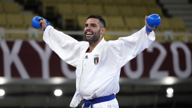 Luigi Busa of Italy reacts after competing in his men's kumite -75kg gold medal bout for karate at the 2020 Summer Olympics, Friday, Aug. 6, 2021, in Tokyo, Japan. (AP Photo/Vincent Thian)