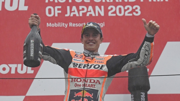 Third placed Repsol Honda Team rider Marc Marquez of Spain celebrates on the podium of the MotoGP Japanese Grand Prix at the Mobility Resort Motegi in Motegi, Tochigi prefecture on October 1, 2023. (Photo by Toshifumi KITAMURA / AFP)