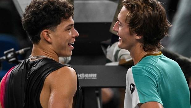 USA's Sebastian Korda (L) talks with USA's Ben Shelton (R) after their men's singles match at the Shanghai Masters tennis tournament in Shanghai on October 12, 2023. (Photo by Hector RETAMAL / AFP)