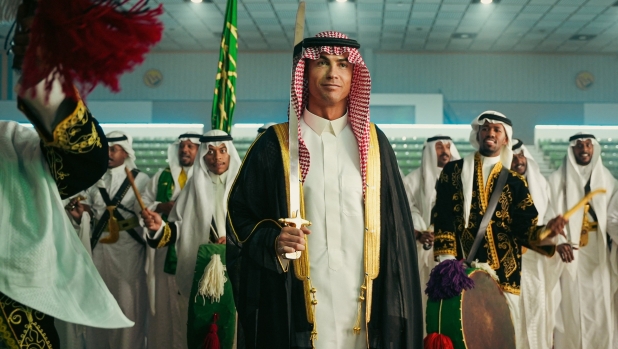 This handout picture released by Al-Nassr Football Club on September 23, 2023, shows the club's Portuguese forward Cristiano Ronaldo in traditional clothing during a ceremony marking Saudi Arabia's national day in Riyadh. (Photo by Al Nassr Football Club / AFP) / RESTRICTED TO EDITORIAL USE - MANDATORY CREDIT "AFP PHOTO / HO /AL NASSR FOOTBALL CLUB" - NO MARKETING NO ADVERTISING CAMPAIGNS - DISTRIBUTED AS A SERVICE TO CLIENTS