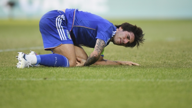 Italy's Sandro Tonali kneels on the pitch after a tackle during the Euro 2023 U21 Championship soccer match between Switzerland and Italy at the Cluj Arena stadium in Cluj, Romania, Sunday, June 25, 2023.(AP Photo/Raed Krishan)
