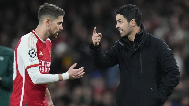 Arsenal's manager Mikel Arteta, right, talks with Arsenal's Jorginho during the Champions League Group B soccer match between Arsenal and Sevilla at Emirates stadium in London Wednesday, Nov. 8, 2023. (AP Photo/Kirsty Wigglesworth)