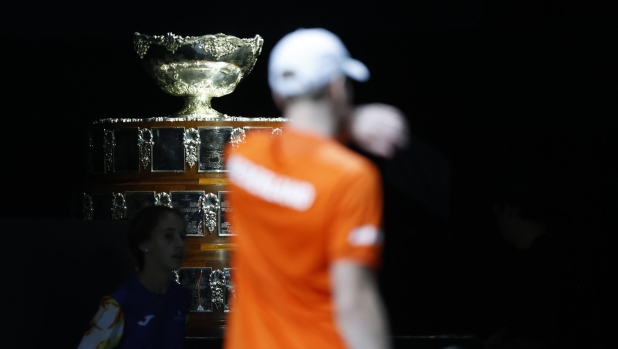 epa10990594 Dutch player Botic van de Zandschulp walks in front of the Davis Cup trophy in his match against Matteo Arnaldi of Italy during the Davis Cup quarter final between Italy and the Netherlands at Martin Carpena pavilion in Malaga, Spain, 23 November 2023.  EPA/Jorge Zapata