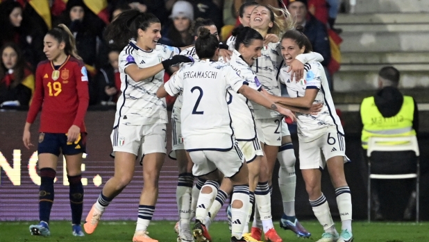 Italy players celebrate their second goal scored by Italy's forward #21 Michela Cambiaghi (2R) during the UEFA Women's Nations League group A4 football match between Spain and Italy at the Pasaron Municipal Stadium in Pontevedra. (Photo by MIGUEL RIOPA / AFP)