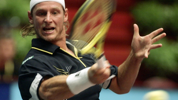 Argentina's David Nalbandian returns the ball to his fellow countryman Juan Ignacio Chela during their first round match at the ATP BA-CA tennis trophy in Vienna, on Tuesday, Oct. 10, 2006. (AP Photo/Hans Punz)