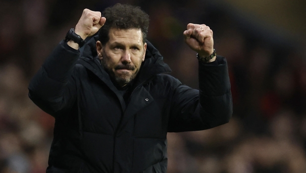 Atletico Madrid's Argentinian coach Diego Simeone reacts to Atletico Madrid's Brazilian forward #12 Samuel Lino's goal during the UEFA Champions League group E football match between Club Atletico de Madrid and Lazio at the Metropolitano stadium in Madrid on December 13, 2023. (Photo by OSCAR DEL POZO / AFP)