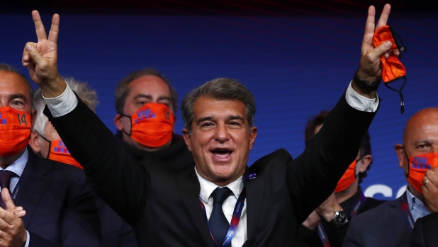 FILE - Joan Laporta celebrates his victory after elections at the Camp Nou stadium in Barcelona, Spain, Sunday, March 7, 2021. The European Union’s top court has ruled UEFA and FIFA acted contrary to EU competition law by blocking plans for the breakaway Super League. The case was heard last year at the Court of Justice after Super League failed at launch in April 2021. UEFA President Aleksander Ceferin called the club leaders “snakes” and “liars.” (AP Photo/Joan Monfort, File)