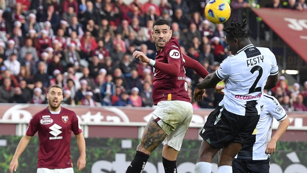 Torino's Antonio Sanabria and Udinese's Ebosele Festy in action during the italian Serie A soccer match Torino FC vs Udinese Calcio at the Olimpico Grande Torino Stadium in Turin, Italy, 23 december 2023 ANSA/ALESSANDRO DI MARCO