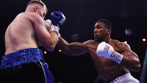 RIYADH, SAUDI ARABIA - DECEMBER 23: Anthony Joshua punches Otto Wallin during the Heavyweight fight between Anthony Joshua and Otto Wallin during the Day of Reckoning: Fight Night at Kingdom Arena on December 23, 2023 in Riyadh, Saudi Arabia. (Photo by Richard Pelham/Getty Images)