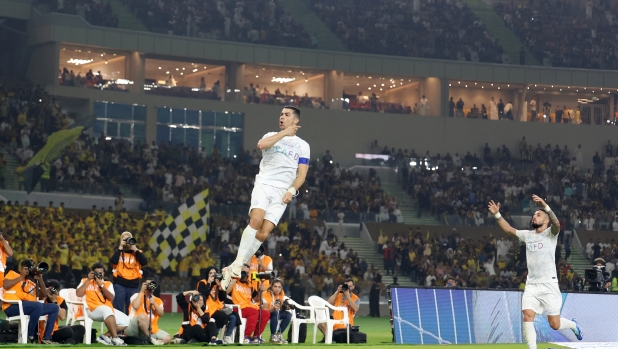 JEDDAH, SAUDI ARABIA - DECEMBER 26: Cristiano Ronaldo of Al Nassr celebrates after scoring the first side goal during the Saudi Pro League match between Al-Ittihad and Al-Nassr at Prince Abdullah Al Faisal Stadium on December 26, 2023 in Jeddah, Saudi Arabia. (Photo by Yasser Bakhsh/Getty Images)