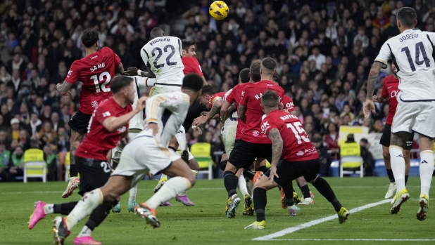 Real Madrid's Antonio Rudiger scores his side's first goal during the Spanish La Liga soccer match between Real Madrid and Mallorca at the Santiago Bernabeu stadium in Madrid, Spain, on Wednesday, January 3, 2024. (AP Photo/Bernat Armangue)