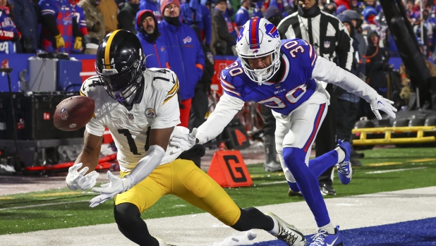Pittsburgh Steelers wide receiver George Pickens (14) can't make the catch in the end zone under pressure from Buffalo Bills cornerback Dane Jackson (30) during the second half of an NFL wild-card playoff football game, Monday, Jan. 15, 2024, in Buffalo, N.Y. (AP Photo/Jeffrey T. Barnes)