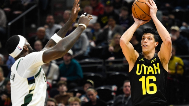 SALT LAKE CITY, UTAH - FEBRUARY 04: Simone Fontecchio #16 of the Utah Jazz shoots over Bobby Portis #9 of the Milwaukee Bucks during the second half at Delta Center on February 04, 2024 in Salt Lake City, Utah. NOTE TO USER: User expressly acknowledges and agrees that, by downloading and or using this photograph, User is consenting to the terms and conditions of the Getty Images License Agreement.   Alex Goodlett/Getty Images/AFP (Photo by Alex Goodlett / GETTY IMAGES NORTH AMERICA / Getty Images via AFP)