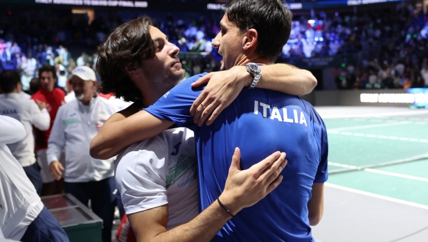 MALAGA, SPAIN - NOVEMBER 25: Lorenzo Sonego and Lorenzo Musetti of Italy celebrate after victory during the Semi-Final doubles match against Serbia in the Davis Cup Final at Palacio de Deportes Jose Maria Martin Carpena on November 25, 2023 in Malaga, Spain. (Photo by Clive Brunskill/Getty Images for ITF)