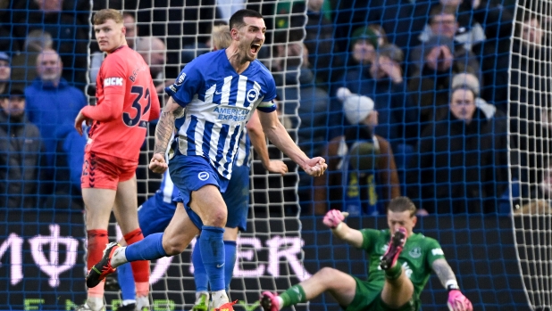 BRIGHTON, ENGLAND - FEBRUARY 24: Lewis Dunk of Brighton & Hove Albion celebrates scoring his team's first goal during the Premier League match between Brighton & Hove Albion and Everton FC at the American Express Community Stadium on February 24, 2024 in Brighton, England. (Photo by Mike Hewitt/Getty Images)