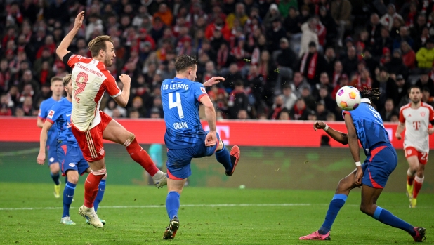 MUNICH, GERMANY - FEBRUARY 24: Harry Kane of Bayern Munich scores his team's second goal  during the Bundesliga match between FC Bayern München and RB Leipzig at the Allianz Arena on February 24, 2024 in Munich, Germany. (Photo by Matthias Hangst/Getty Images)