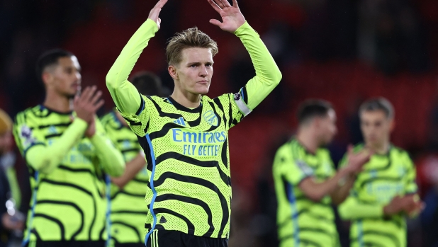Arsenal's Norwegian midfielder #08 Martin Odegaard applauds the fans following during the English Premier League football match between Sheffield United and Arsenal at Bramall Lane in Sheffield, northern England on March 4, 2024. (Photo by Darren Staples / AFP) / RESTRICTED TO EDITORIAL USE. No use with unauthorized audio, video, data, fixture lists, club/league logos or 'live' services. Online in-match use limited to 120 images. An additional 40 images may be used in extra time. No video emulation. Social media in-match use limited to 120 images. An additional 40 images may be used in extra time. No use in betting publications, games or single club/league/player publications. /