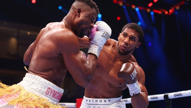 RIYADH, SAUDI ARABIA - MARCH 08: Anthony Joshua punches Francis Ngannou during the Heavyweight fight between Anthony Joshua and Francis Ngannou on the Knockout Chaos boxing card at the Kingdom Arena on March 08, 2024 in Riyadh, Saudi Arabia. (Photo by Richard Pelham/Getty Images)