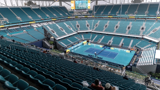 epa11236932 The Main Stadium is empty due the rain at the Hard Rock Stadium in Miami, Florida, USA, 22 March 2024. The 2024 Miami Open tennis tournament second round session has been delayed due inclement weather. The National Weather Service's Storm Prediction Center has placed South Florida under a risk of severe weather with the potential for heavy rain, flooding, winds, and isolated tornadoes.  EPA/CRISTOBAL HERRERA-ULASHKEVICH