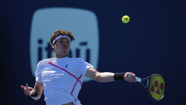 Ben Shelton returns a ball from Martin Landaluce, of Spain, in their men's second round match at the Miami Open tennis tournament, Sunday, March 24, 2024, in Miami Gardens, Fla. (AP Photo/Rebecca Blackwell)