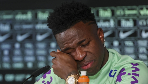 epa11243024 Brazil player Vinicius Junior sheds a tear as he attends a press conference in Madrid, Spain, 25 March 2024. Real Madrid player Vinicius Jr was asked by the media about the racist abuse he has been suffering over the last few years in Spain. Brazil is to face Spain in a friendly match on 26 March.  EPA/Kiko Huesca