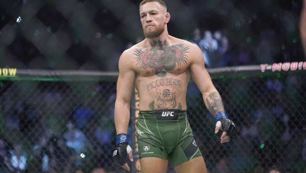 FILE - Conor McGregor prepares to fight Dustin Poirier in a UFC 264 lightweight mixed martial arts bout July 10, 2021, in Las Vegas. Former champion McGregor?s return to action helped trigger a split between the league and the U.S. Anti-Doping Agency. (AP Photo/John Locher, File)