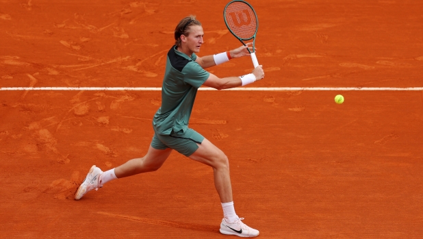 MONTE-CARLO, MONACO - APRIL 10: Sebastian Korda of United States plays a backhand against Jannik Sinner of Italy during the Men's Singles Second Round match on day four of the Rolex Monte-Carlo Masters at Monte-Carlo Country Club on April 10, 2024 in Monte-Carlo, Monaco. (Photo by Julian Finney/Getty Images)
