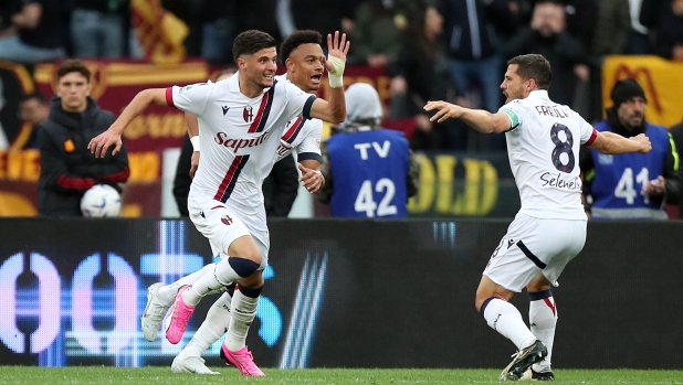 ROME, ITALY - APRIL 22: Oussama El Azzouzi of Bologna FC (L) celebrates scoring his team's first goal with teammate Remo Freuler during the Serie A TIM match between AS Roma and Bologna FC at Stadio Olimpico on April 22, 2024 in Rome, Italy. (Photo by Paolo Bruno/Getty Images)