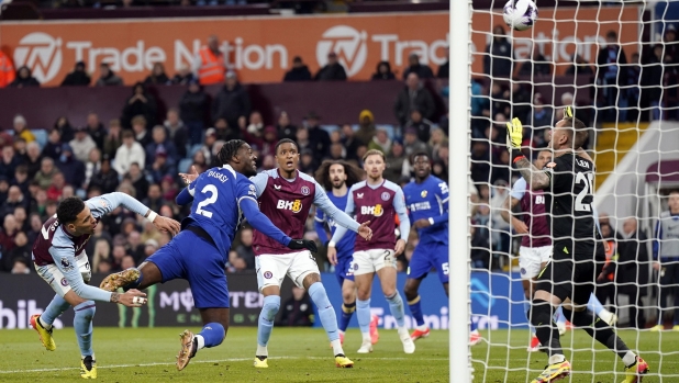 epa11305890 Axel Disasi of Chelsea (L) in action to score a goal which was later disallowed by VAR during the English Premier League soccer match between Aston Villa FC and Chelsea FC, in Birmingham, Britain, 27 April 2024.  EPA/TIM KEETON EDITORIAL USE ONLY. No use with unauthorized audio, video, data, fixture lists, club/league logos, 'live' services or NFTs. Online in-match use limited to 120 images, no video emulation. No use in betting, games or single club/league/player publications.