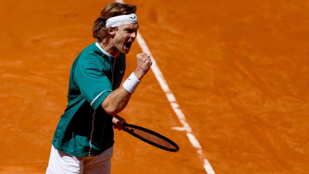 epa11309826 Andrey Rublev of Russia celebrates a point against Tallon Griekspoor of the Netherlands during their Round of 16 match at the Madrid Open tennis tournament at Caja Magica tennis complex in Madrid, Spain, 30 April 2024.  EPA/Daniel Gonzalez