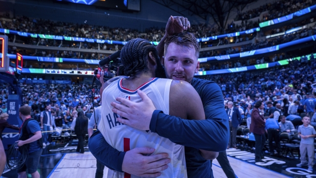 Dallas Mavericks' Luka Doncic, right, hugs Los Angeles Clippers guard James Harden (1) after the Mavericks beat Clippers 114-101 and clinched the series in Game 6 of an NBA basketball first-round playoff series Friday, May 3, 2024, in Dallas. (AP Photo/Jeffrey McWhorter)