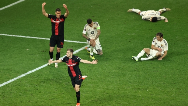 LEVERKUSEN, GERMANY - MAY 09: Josip Stanisic of Bayer Leverkusen celebrates scoring his team's second goal during the UEFA Europa League 2023/24 Semi-Final second leg match between Bayer 04 Leverkusen and AS Roma at BayArena on May 09, 2024 in Leverkusen, Germany. (Photo by Christof Koepsel/Getty Images)
