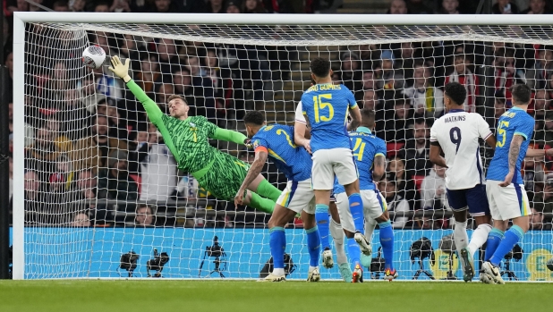 Brazils' goalkeeper Bento saves during an international friendly soccer match between England and Brazil, at the Wembley Stadium in London, Saturday, March 23, 2024. (AP Photo/Kirsty Wigglesworth)