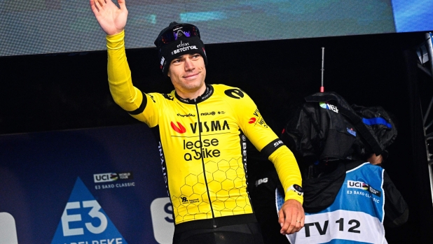 Third placed Team Visma-Lease a Bike's Belgian rider Wout van Aert waves on the podium after the 'E3 Classic' one day cycling race, in Harelbeke, on March 22, 2024. (Photo by JASPER JACOBS / Belga / AFP) / Belgium OUT