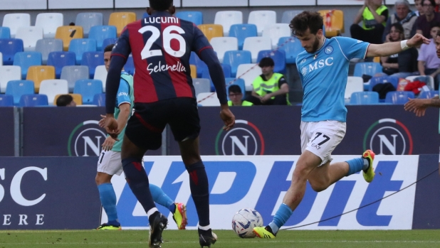 Bologna?s defender Jhon Lucumí (L) and  Napoli?s forward Khvicha Kvaratskhelia (R)  in action during the Italian Serie A soccer match between SSC Napoli  and Bologna FC  at ' Diego Armando Maradona' stadium in Naples , Italy,  11 May 2024. ANSA/CESARE ABBATE