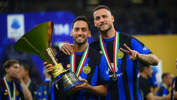 MILAN, ITALY - MAY 19: Lautaro Martinez and Marko Arnautovic of FC Internazionale celebrate with the trophy after winning the Serie A title and the 20th Scudetto after the Serie A TIM match between FC Internazionale and SS Lazio at Stadio Giuseppe Meazza on May 19, 2024 in Milan, Italy. (Photo by Mattia Pistoia - Inter/Inter via Getty Images)