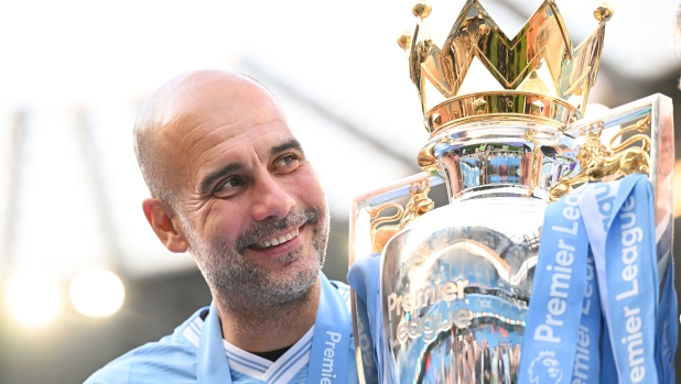 MANCHESTER, ENGLAND - MAY 19: Pep Guardiola, Manager of Manchester City, poses for a photo with the Premier League title trophy following the team's victory in the Premier League match between Manchester City and West Ham United at Etihad Stadium on May 19, 2024 in Manchester, England. (Photo by Michael Regan/Getty Images)