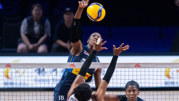 (240530) -- MACAO, May 30, 2024 (Xinhua) -- Paola Ogechi Egonu (top) of Italy spikes the ball during the preliminary match between Italy and the Dominican Republic at the Women's Volleyball Nations League 2024 Macao in Macao, south China, May 30, 2024. (Xinhua/Cheong Kam Ka) (Photo by Cheong Kam Ka / XINHUA / Xinhua via AFP)